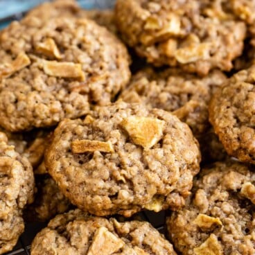 Group of apple oatmeal cookies on a metal cooking rack