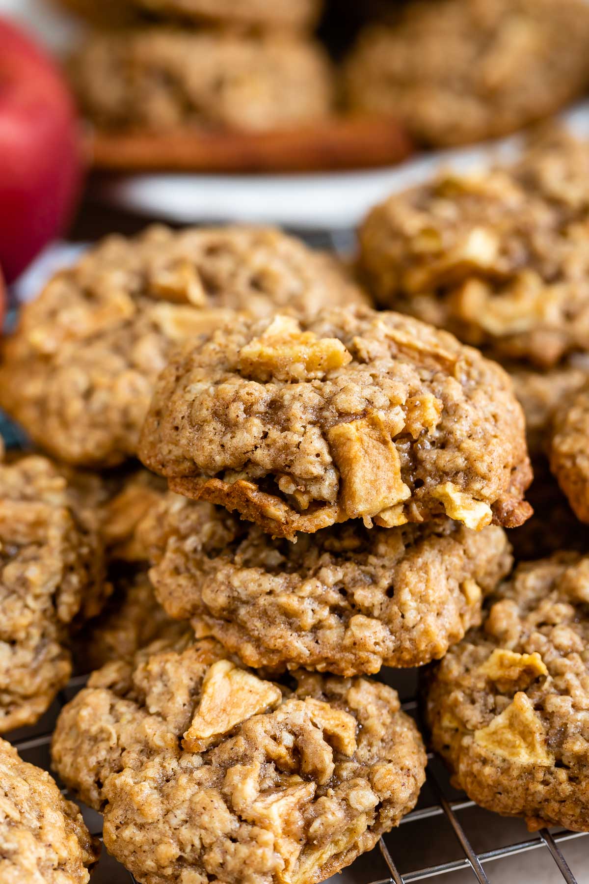 Group of apple oatmeal cookies on a metal cooking rack