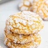 A stack of three crinkle cookies dusted with powdered sugar, labeled Cool Whip Cookies.