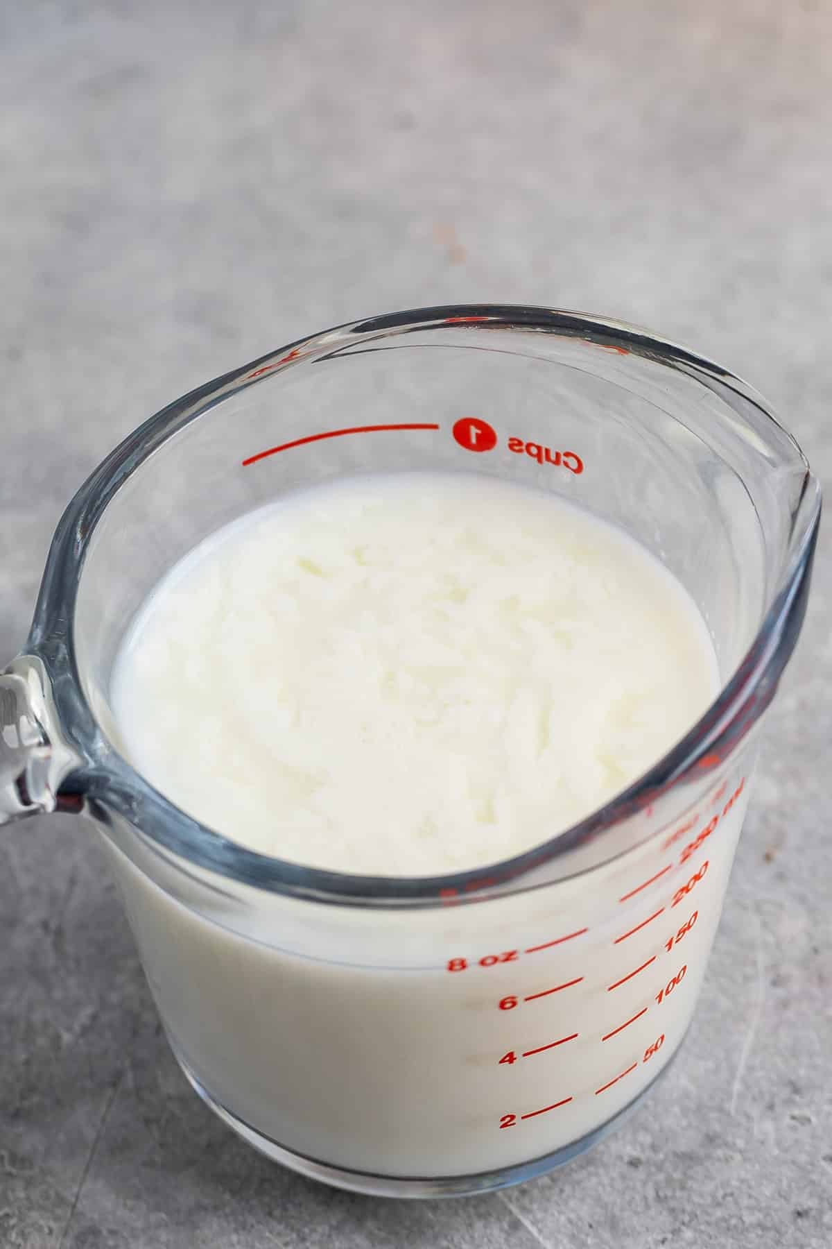 glass measuring cup of buttermilk.