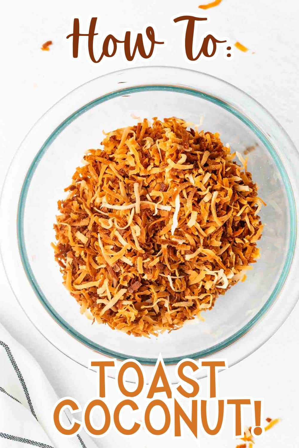 A glass bowl filled with golden brown toasted shredded coconut sits on a white surface. Text above and below the bowl reads, How To: Toast Coconut! in bold, stylized font.
